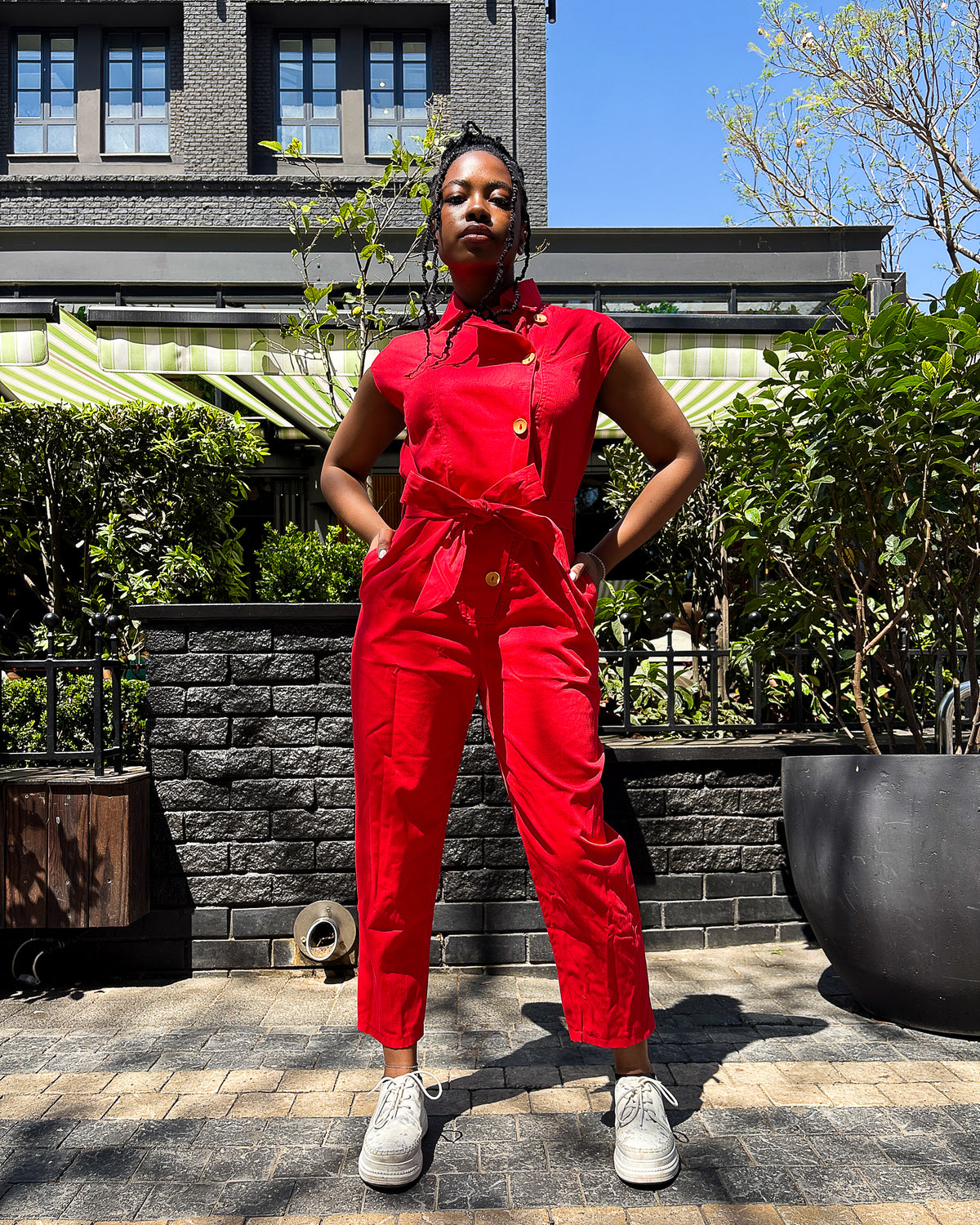 Woman wearing the Anna Elsabie Long Jumpsuit in cotton twill by Dr Pachanga Clothing, South Africa.