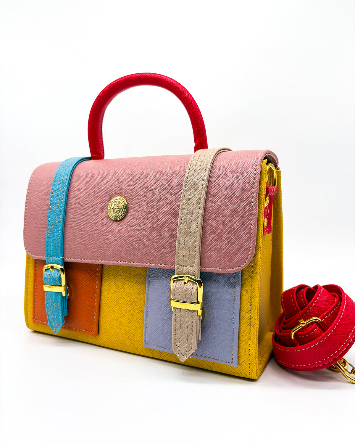 Orange vegan leather handbag or crossbody bag, with African Wax fabric inlay, two gold buckles and a magnetic clasp.