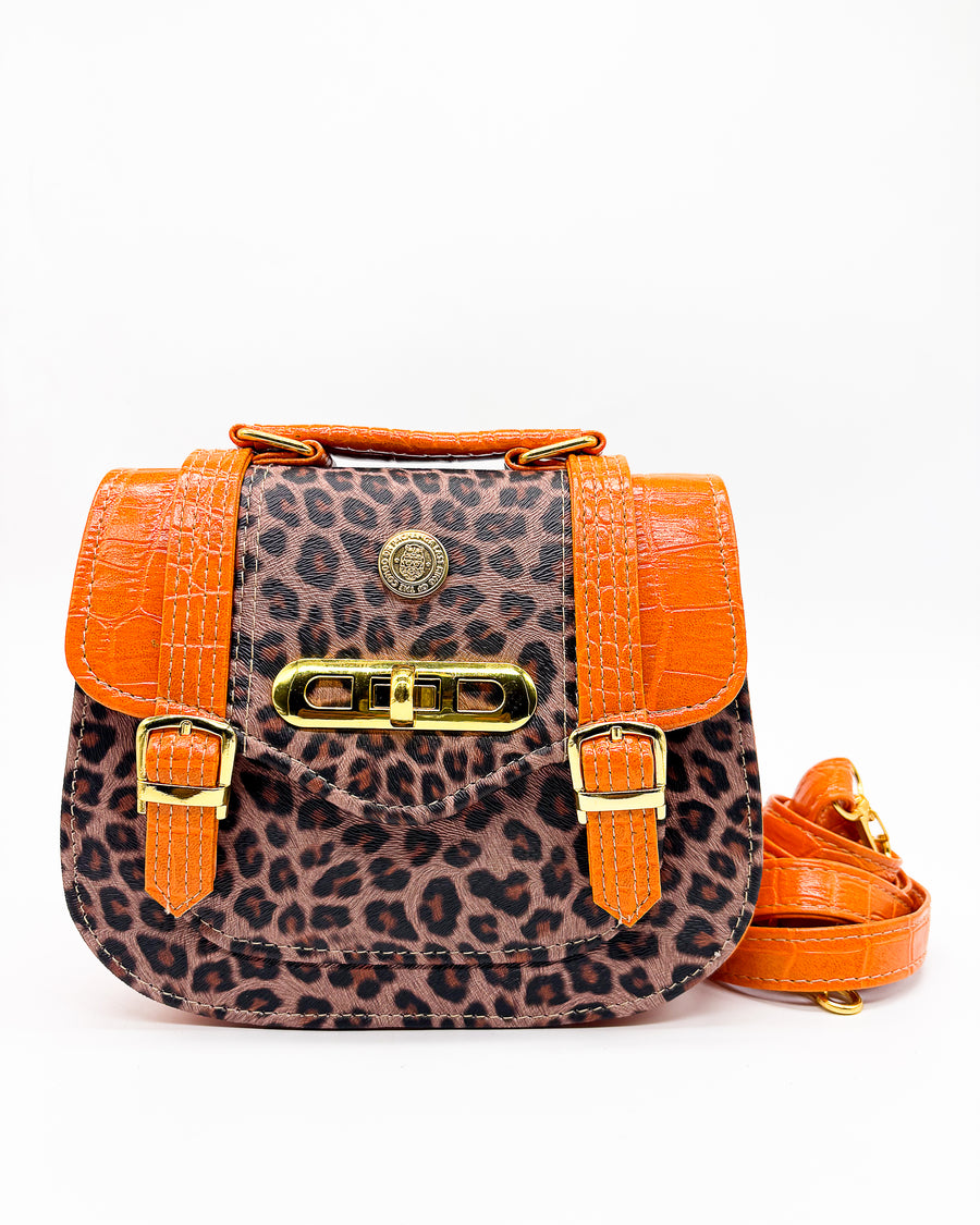 Leopard print handbag with orange accents on a white background