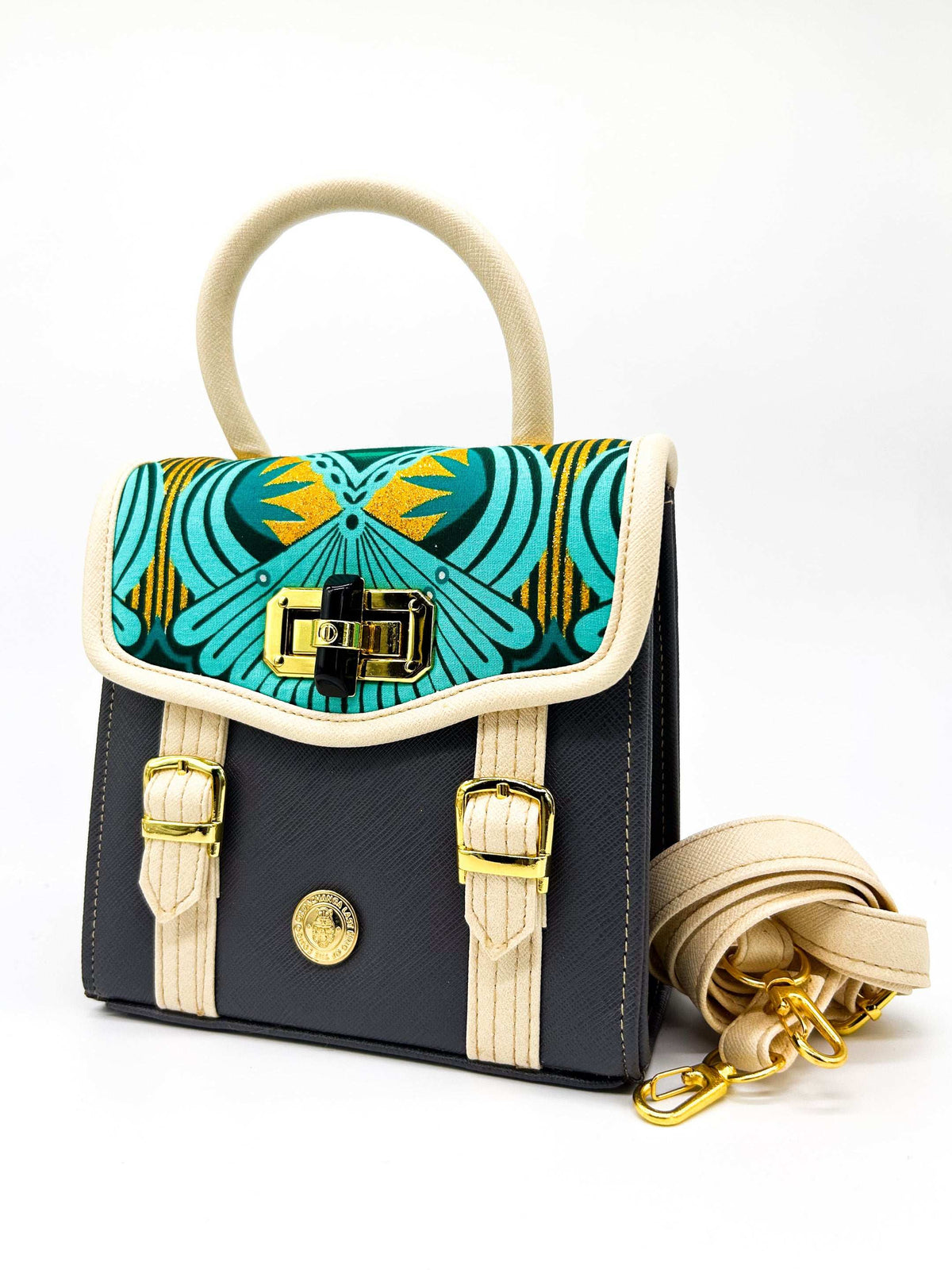 Black vegan leather handbag, backpack or crossbody bag with aquamarine African wax fabric inlay, two gold buckled clasps and a twist-lock.