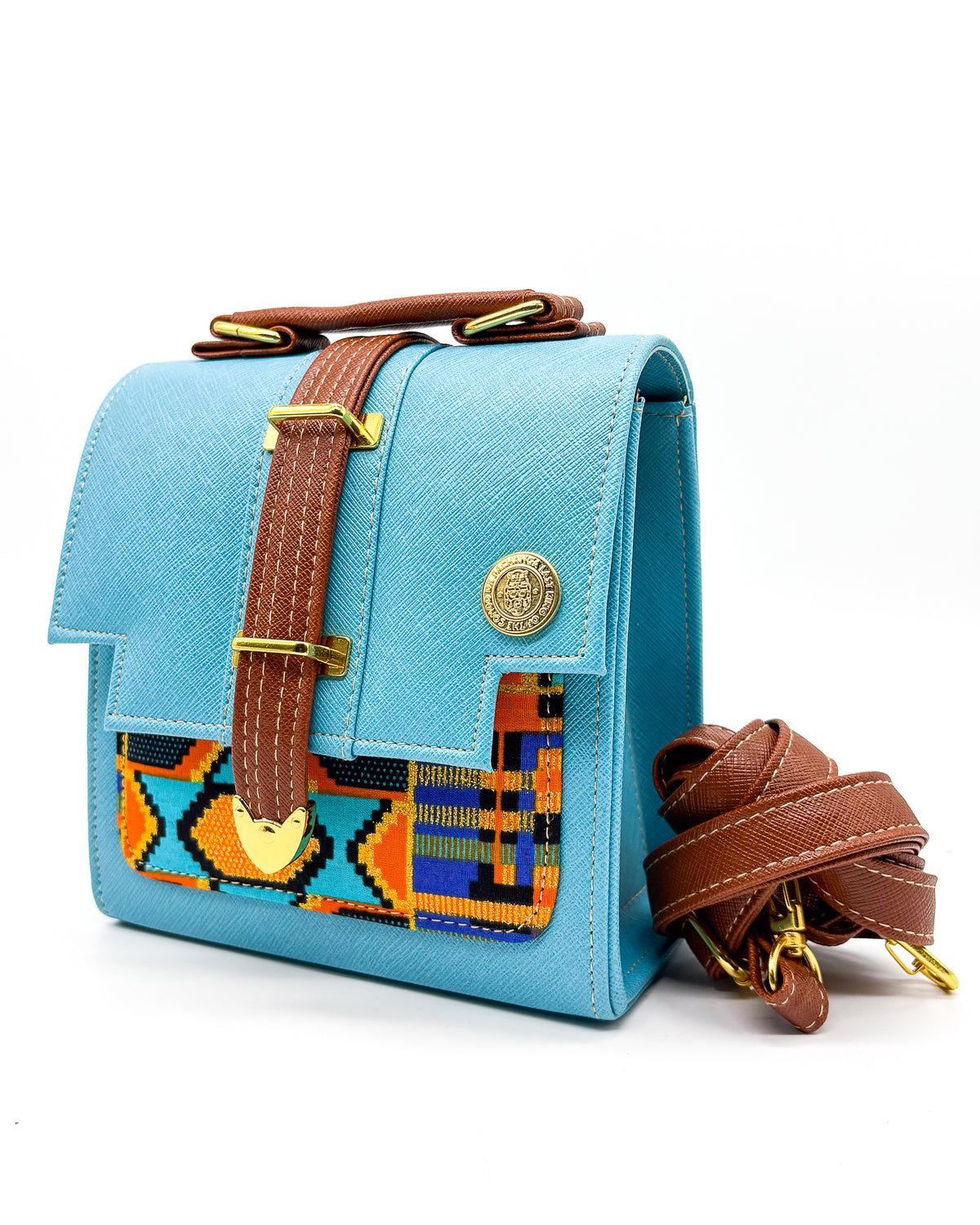 Turquoise vegan leather handbag or crossbody bag with colourful African wax fabric inlay, and a gold magnetic clasp.