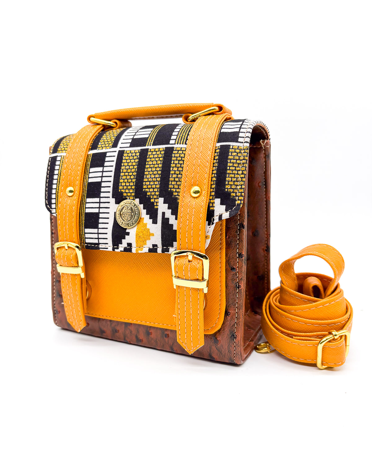 Brown vegan leather handbag or crossbody bag with orange accents, gold African Wax fabric inlay, two gold buckles and magnetic clasp.