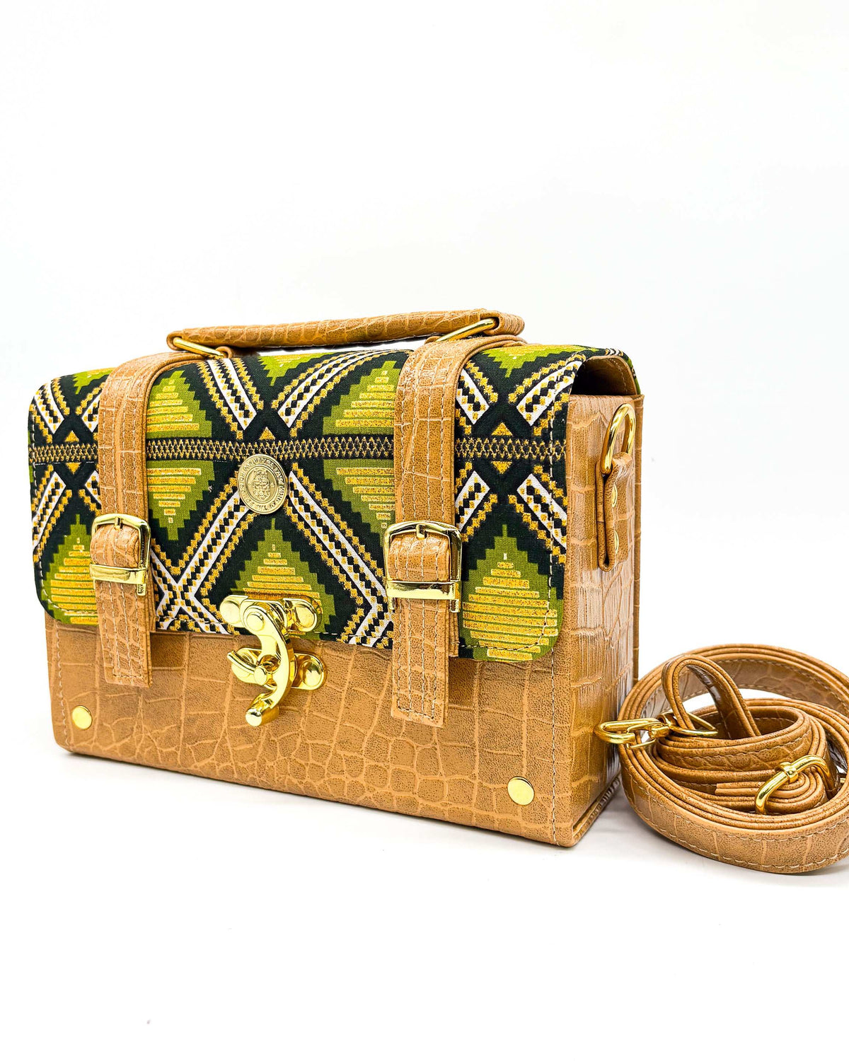 Mustard textured vegan leather handbag or crossbody bag with green and gold African wax fabric inlay, two gold buckles and a gold clasp.