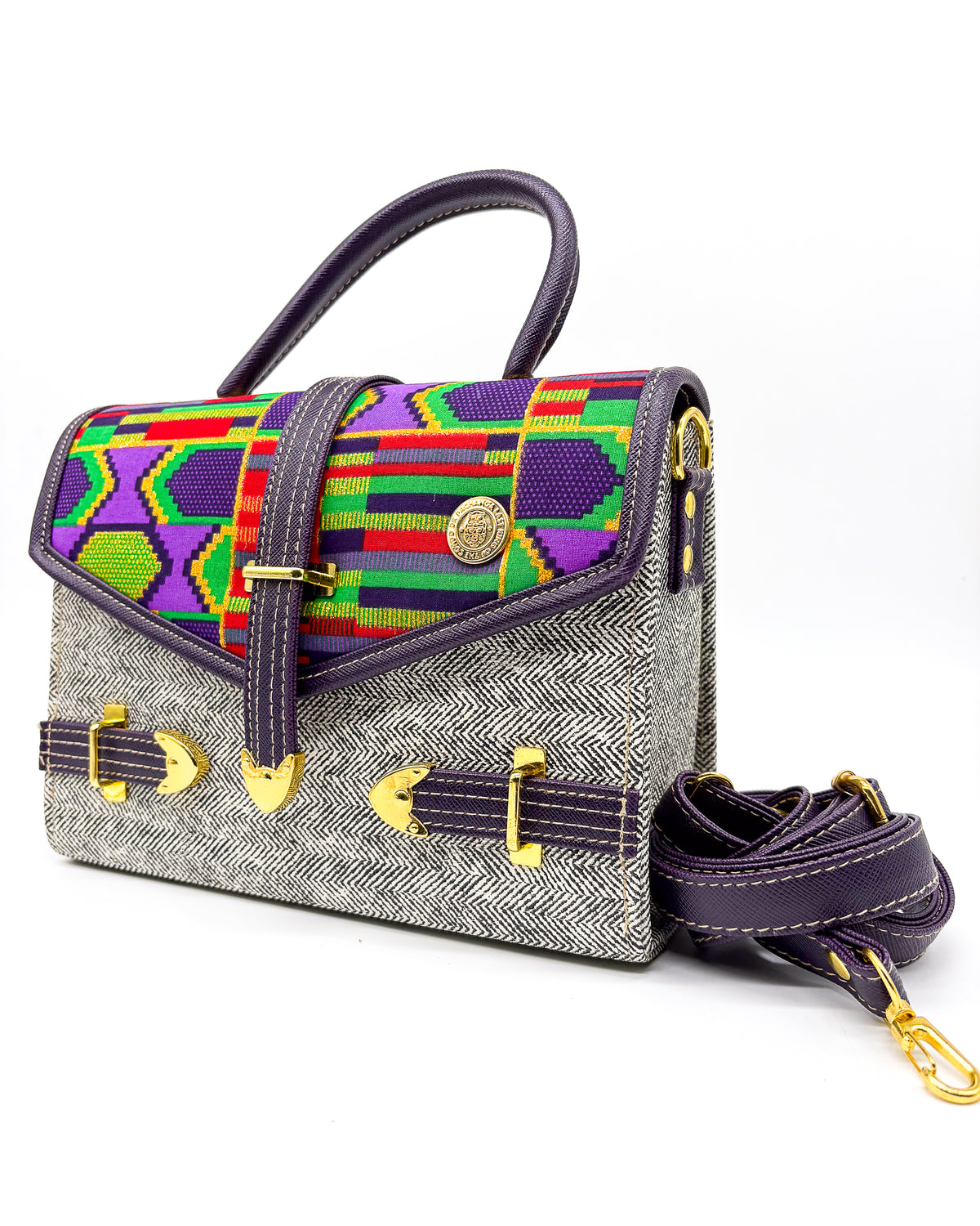 Grey vegan leather handbag or crossbody bag, with colourful African Wax fabric inlay, three gold buckles and a magnetic clasp.