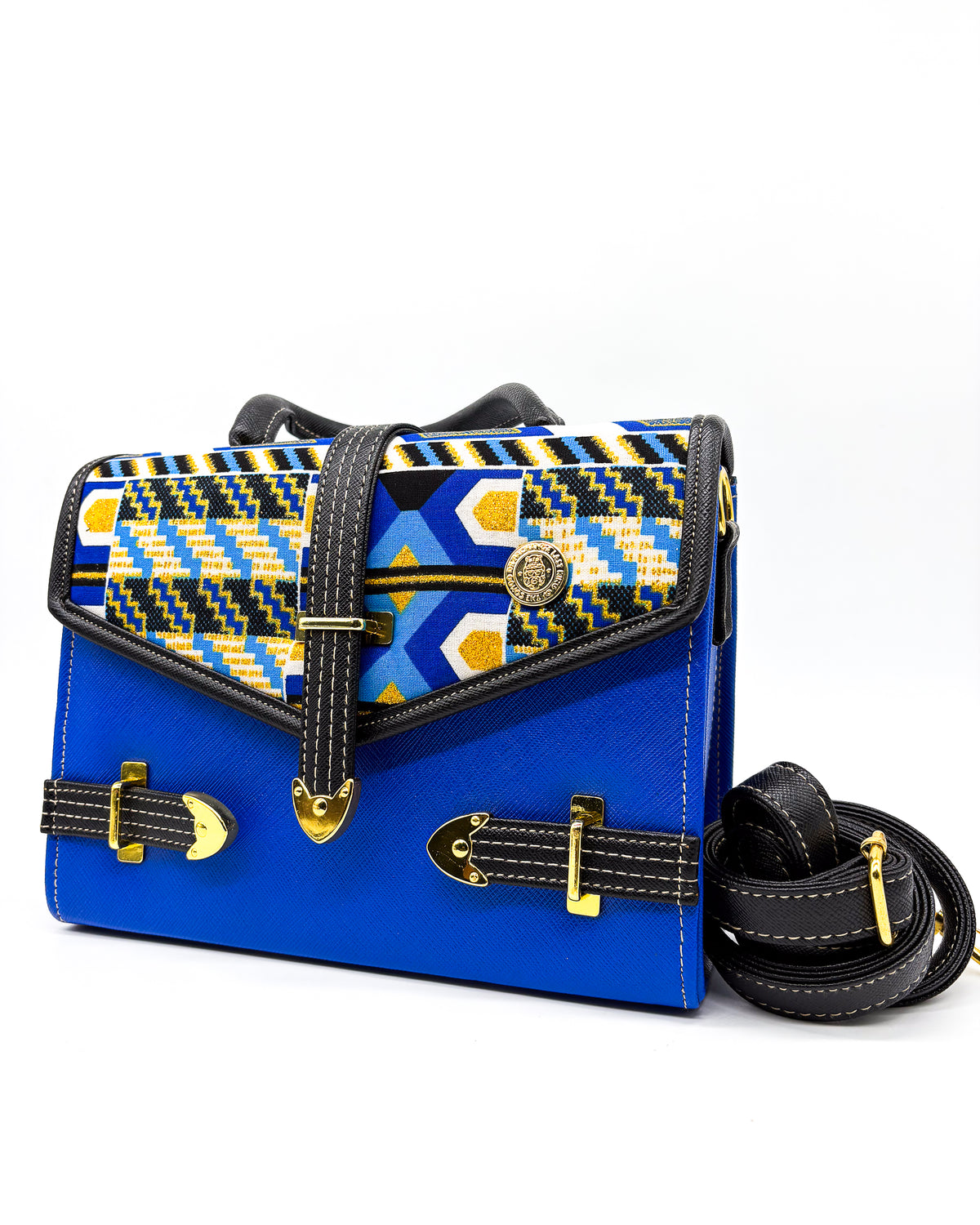 Electric blue vegan leather handbag or crossbody bag, with blue and gold African Wax fabric inlay, three gold buckles and a magnetic clasp.