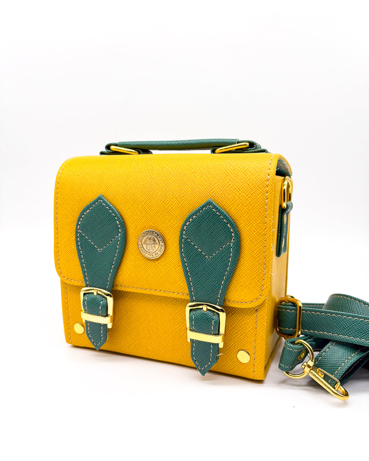 Yellow and green vegan leather handbag or crossbody bag with African wax fabric interior lining, two gold buckles and a magnetic clasp.